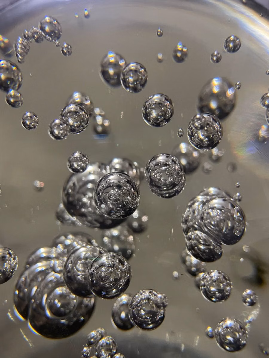 liquid mercury droplets macro photograph - 
