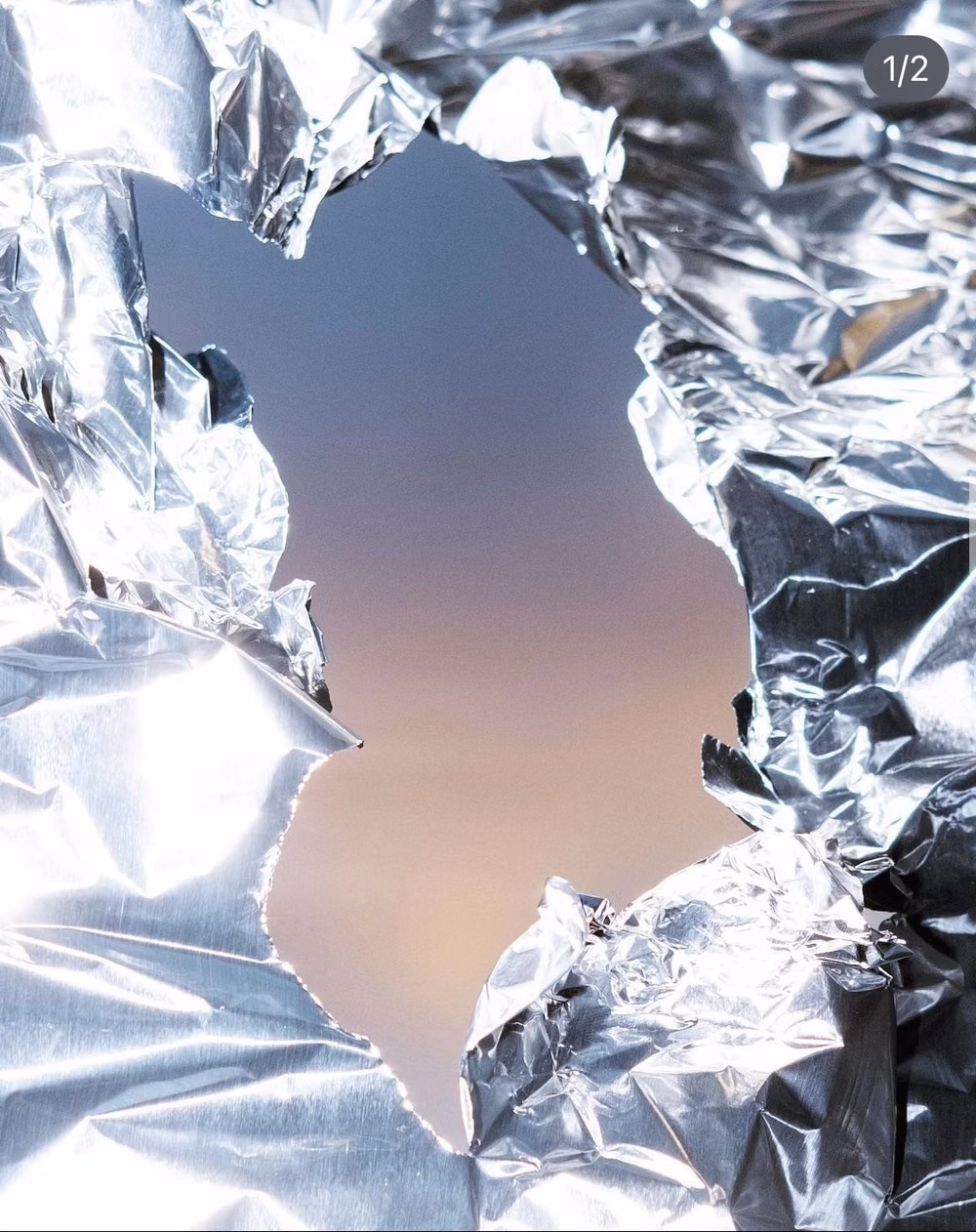 crumpled aluminum foil reflective macro photograph -
