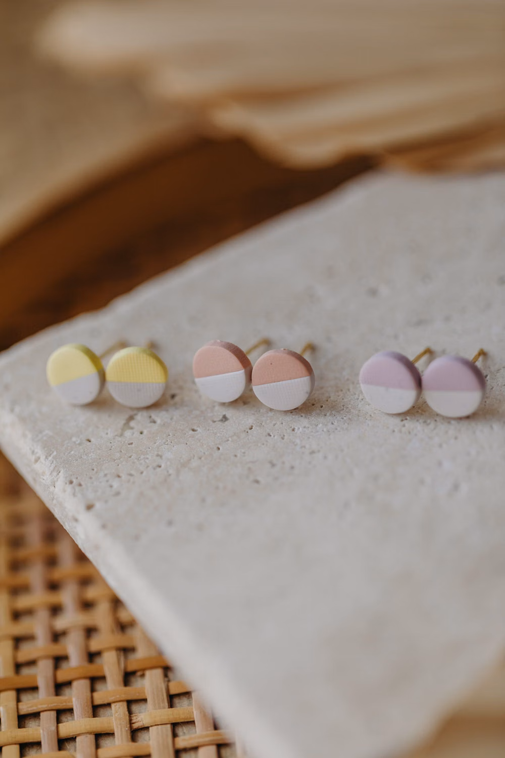 pastel polymer clay pieces studio photograph - These small, round stud earrings made of high-quality polymer clay in soft pastel colors are the perfect color accent for your outfit. With a diameter of only 8 mm, they offer a subtle yet striking presence. The harmonious two-tone design in delicate pastel shades ensures a fresh, elegant look and makes these stud earrings a versatile accessory for any occasion. Whether for everyday wear or special moments, these stud earrings effortlessly integrate into your look and add a subtle yet stylish touch. Their minimalist design pairs wonderfully with various outfits, while the lightweight polymer material offers high wearing comfort. Available earrings: A - white speckled - light yellow B - white speckled - light pink C - white speckled - light purple D - white speckled - light blue E - white s