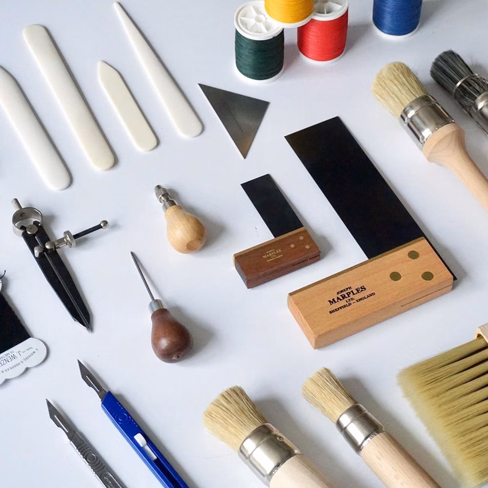 bookbinding paste brush and glue pot workspace photograph - London Centre for Book Arts on Instagram: “Shop for #bookbinding tools and materials in-person and online londonbookarts.org. “We do our best to find tools that are made in the UK,…”
