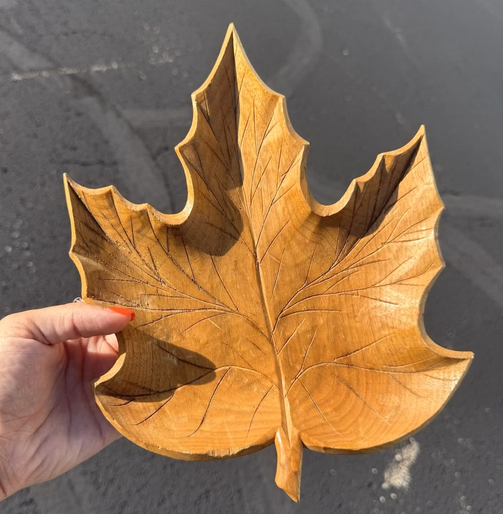 intricate hand carved wood leaf detail photograph - 