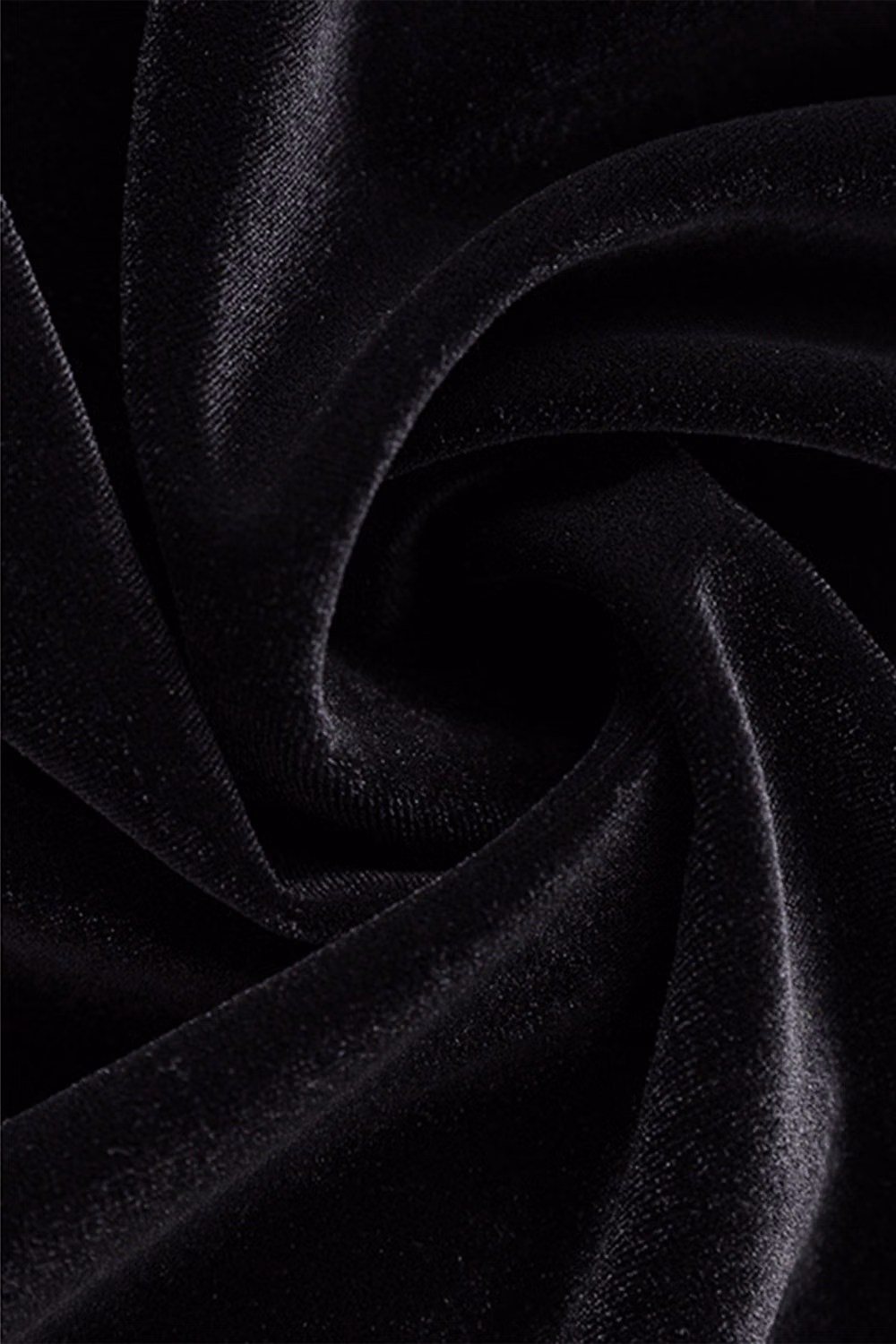black velvet folds dramatic light photograph - Elegance that catches the light. The Black Velvet Long Sleeve Maxi Dress drapes beautifully in fine, light-reflective velvet, cut close through the body before gently flaring at the cuffs and hem. The sculpted waist and fluid skirt create a quiet hourglass line that moves with poise. Ideal for evening dinners or winter occasions, it’s understated confidence in motion. Our Favorite Details:• Crew neckline• Long sleeves• Bell cuffs• Fitted waist• Mermaid hem Material:79.1% Polyamide 13.2% Triacetate 7.7% Polyester Style #: WWSK921