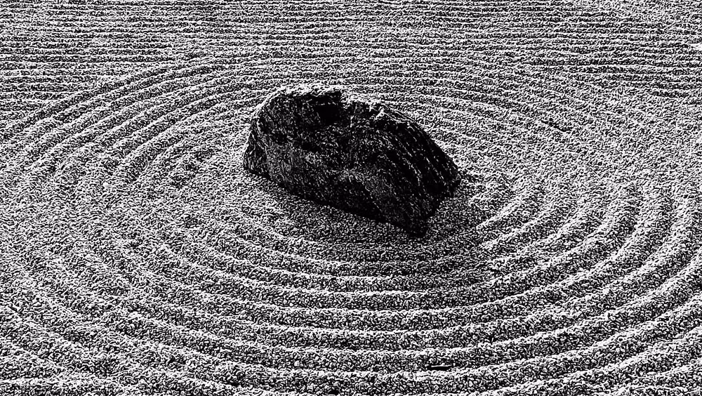 raked gravel Japanese garden detail photograph -