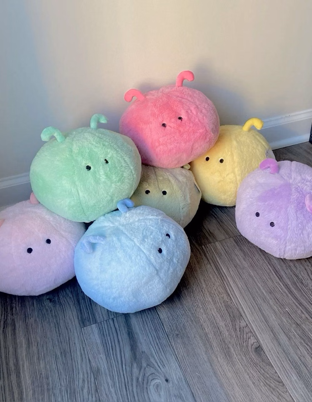 small rounded plush toys pastel photograph -