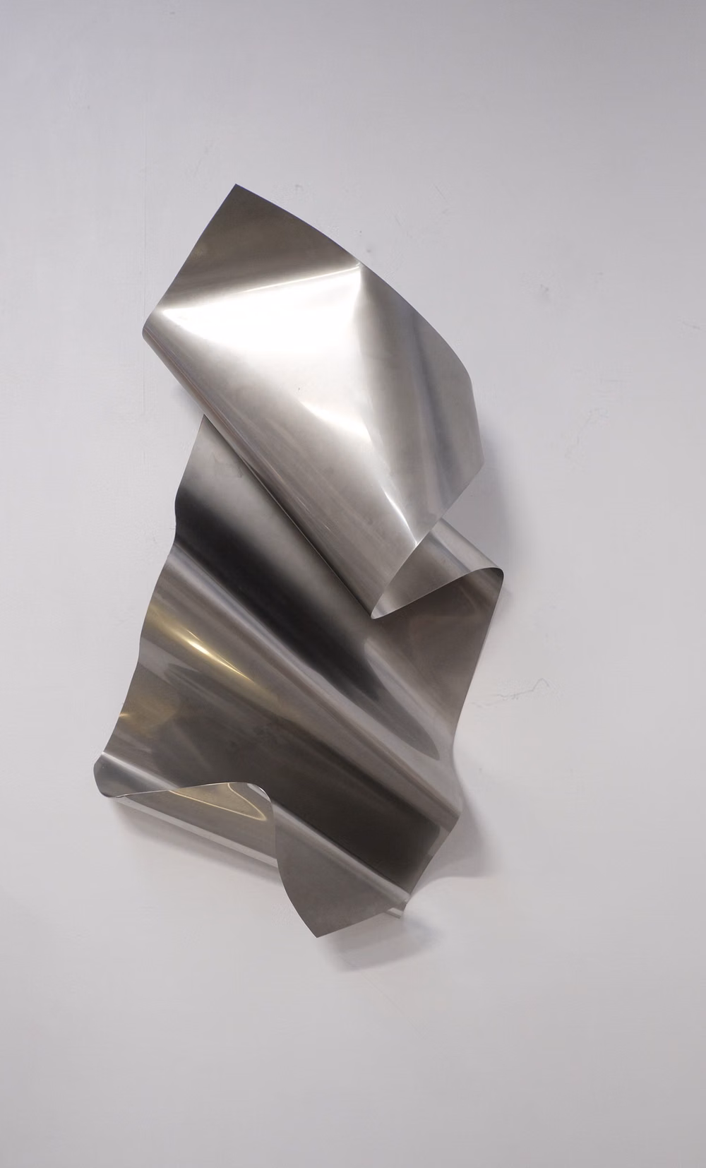 faceted folded metal surface photograph - FOLDS — THE VISUALS