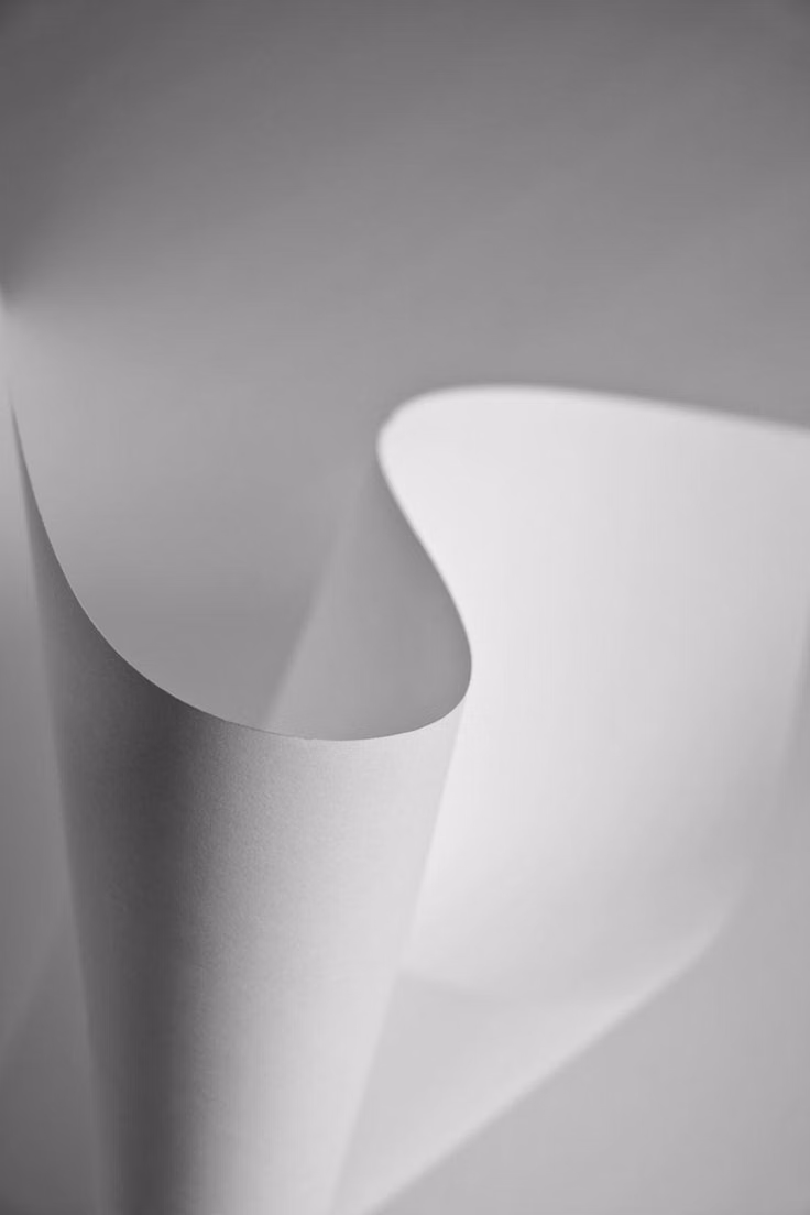folded paper cast shadow studio photograph -