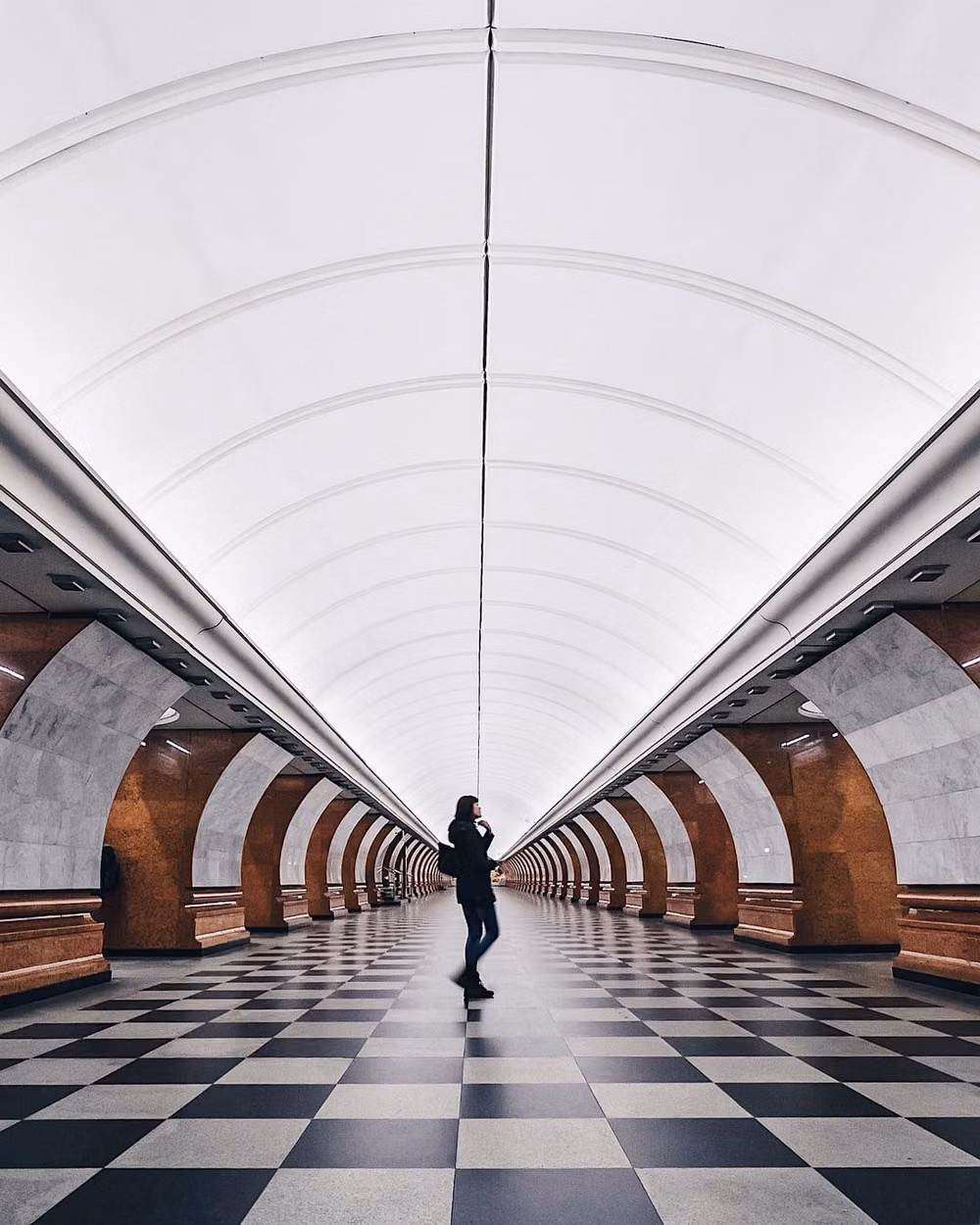 metro platform geometric floor markings photograph -