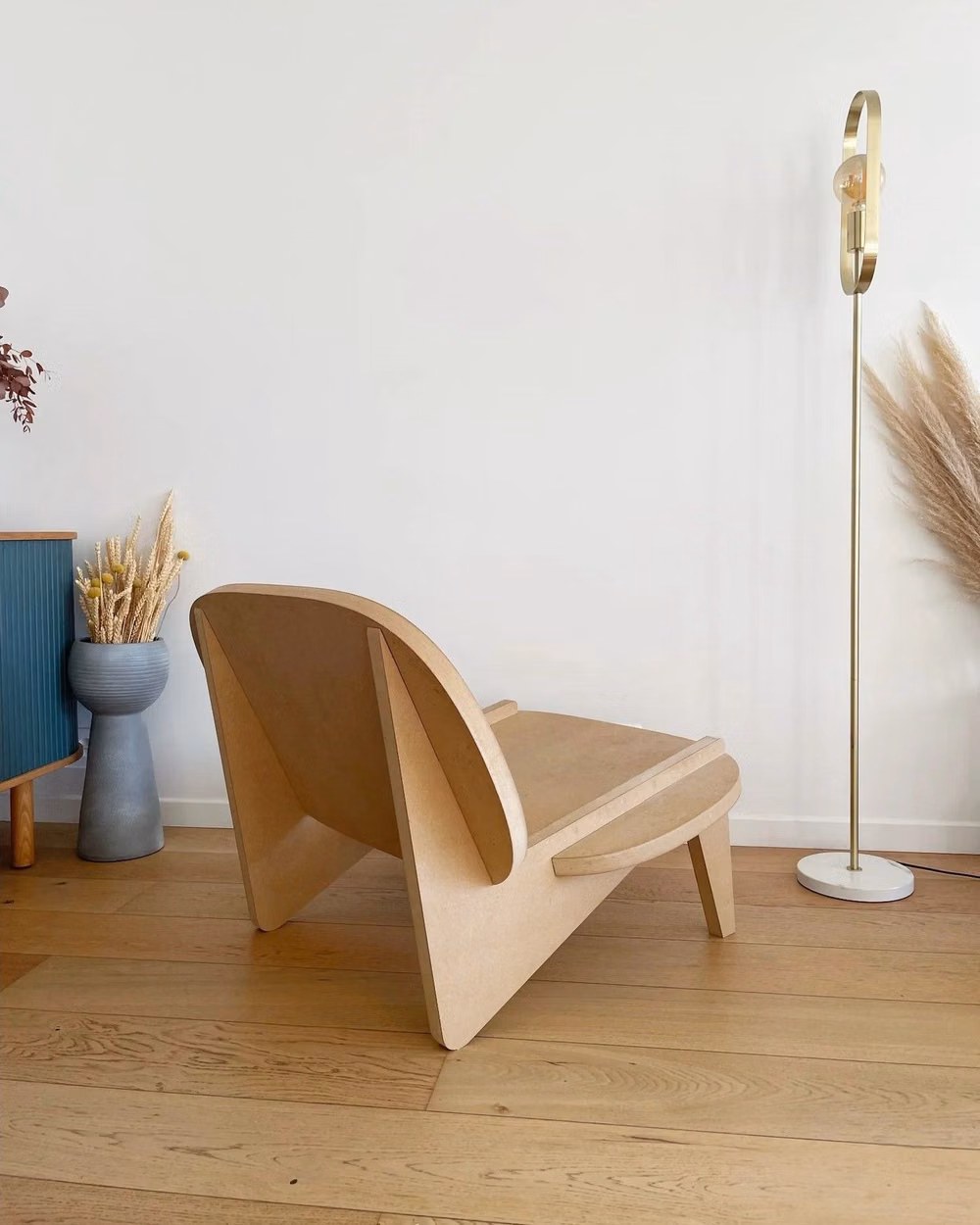 molded plywood lounge chair detail photograph - Structural yet seamless. A chair that finds its form through precision and restraint. Four interlocking wooden panels, no screws, no excess—just the essence of assembly. Over time, the wood shifts, breathes, evolves, making each piece as alive as the space it inhabits. La Lounge, by @pierrehenrybor