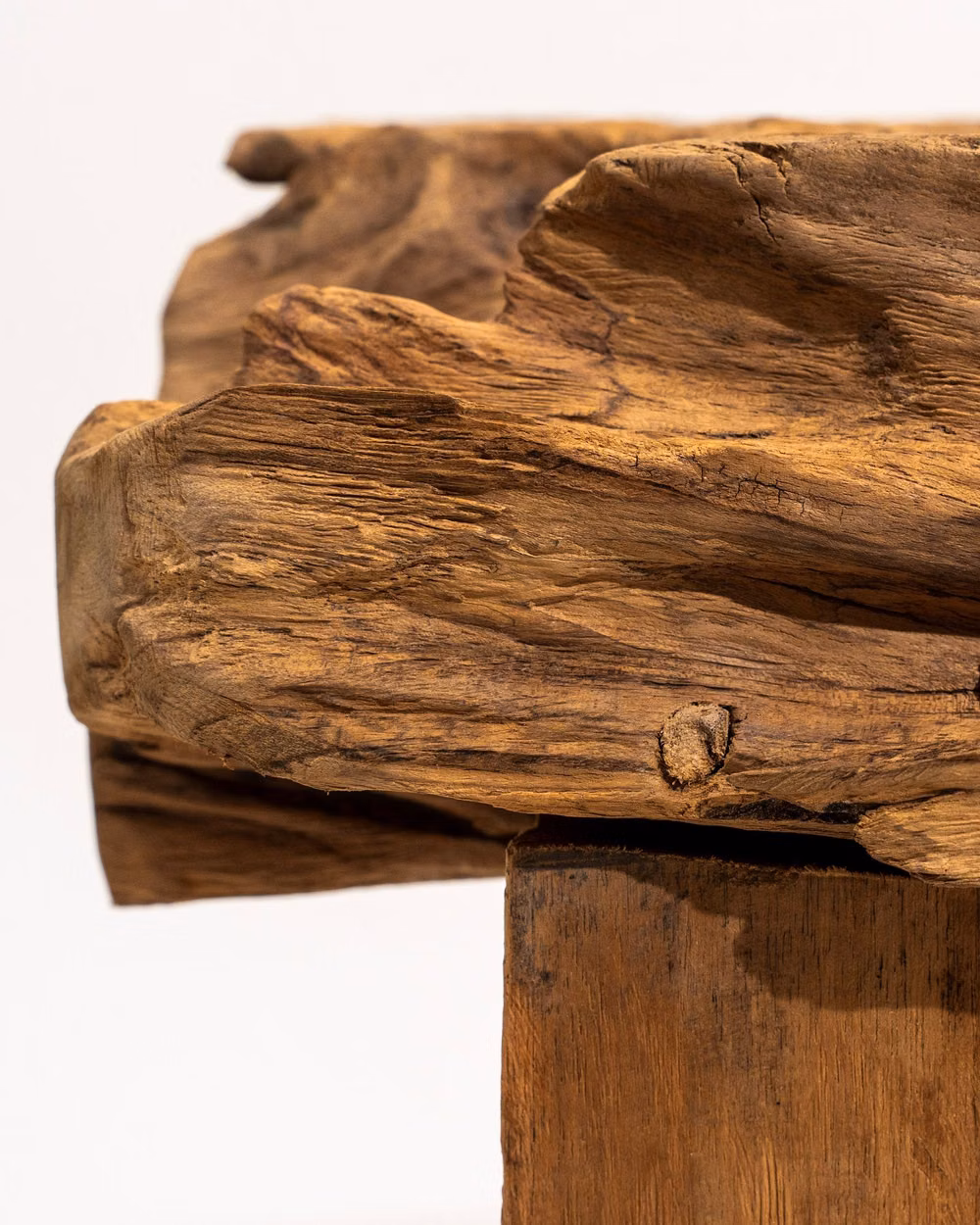 teak wood furniture grain close up photograph - Century-old teak wood, once part of historic Javanese houses and railways, finds new form in our Nocturne stool, Palma bench, and Vesna table. Each knot, groove, and grain tells a story - of resilience, heritage, and the beauty of raw imperfection. Designed to be touched, felt, and lived with, this is where sustainability meets timeless craftsmanship. 🌿✨