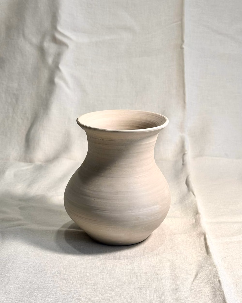 single unglazed ceramic vessel white background photograph - Bellied Vase | Raw Stoneware

Hand-thrown in the studio.

A study in unglazed form and natural texture.