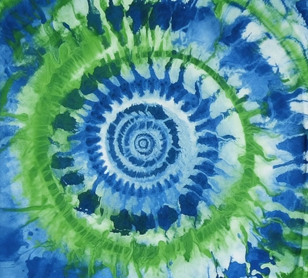 tie dye fabric spiral close up photograph - 