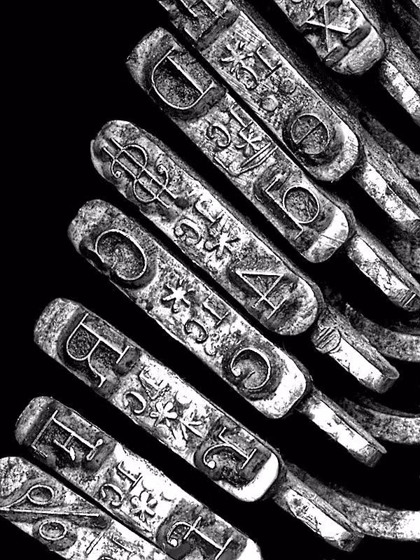 typewriter letters uneven ink close up photograph - 
