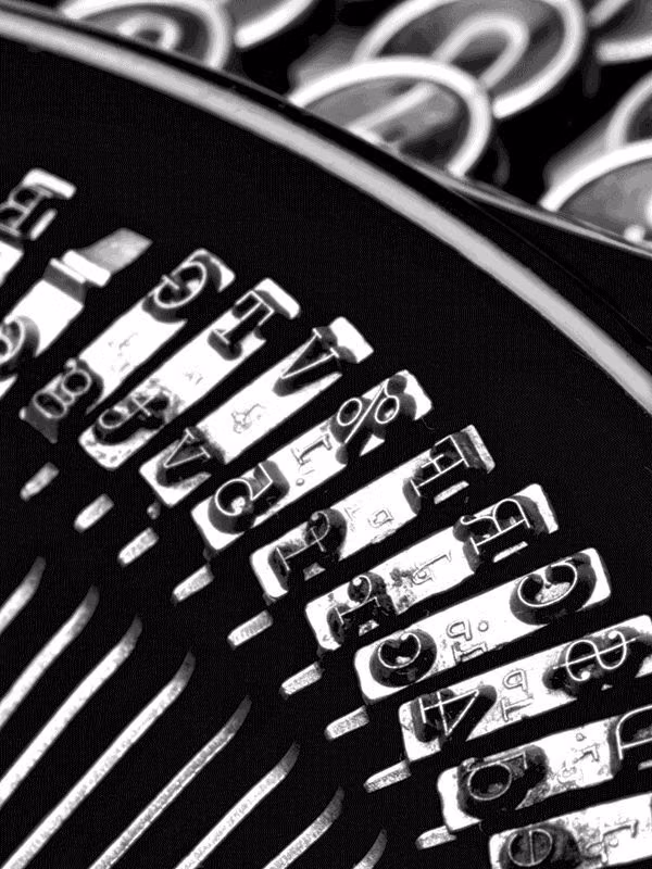 typewriter letters uneven ink close up photograph -