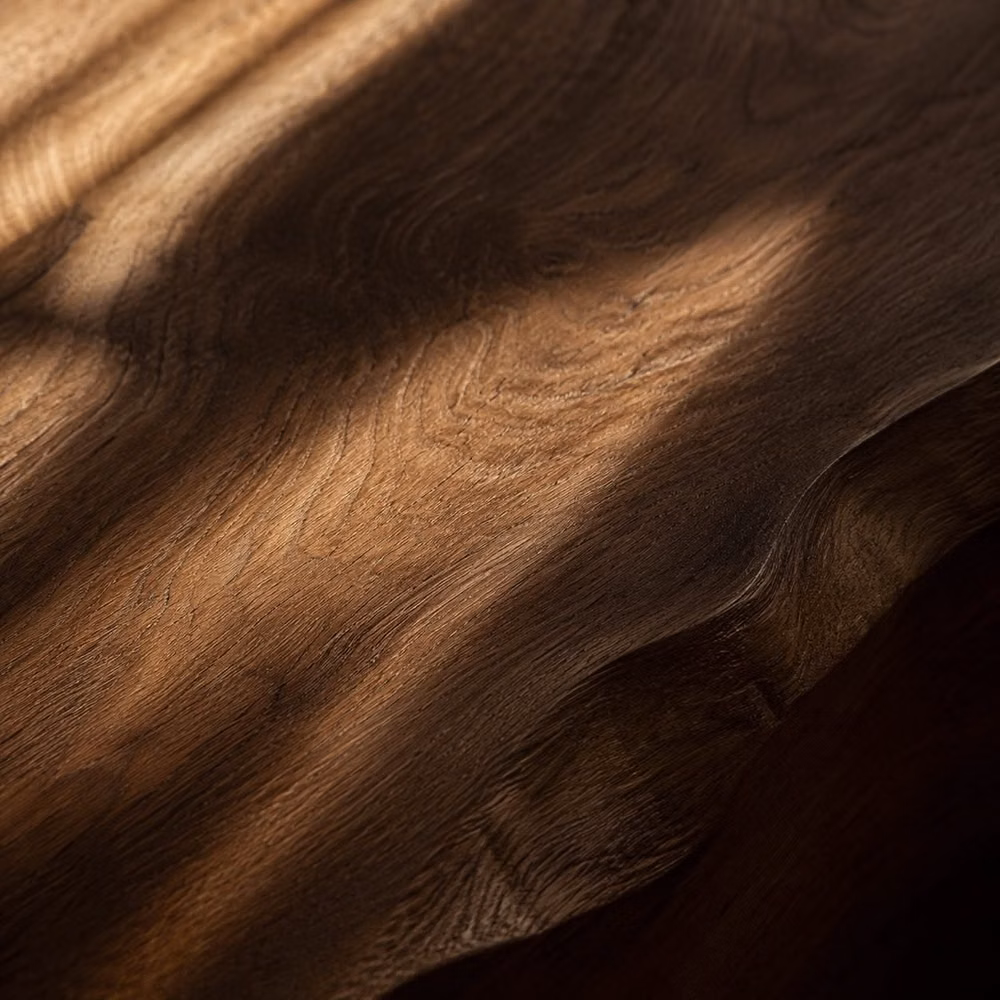 dark walnut wood grain luxury close up - Surfaces you can almost feel. Wood, shadow, depth, and warmth. the kind of details that make a space feel intentional.	  Would you use this tone in your space?