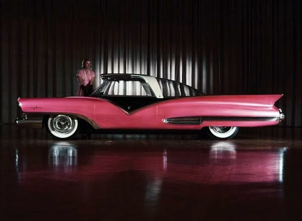 1950s futuristic concept car photograph - Ford Mystere Show Car, 1955 In September of 1955, Ford released photos of a futuristic body design for a car that would be propelled by a gas turbine powerplant. On display during the 1956 Chicago extravagaza, the prototype show car had no engine, although provisions were made to fit one under the rear deck. Cargo and spare tire were housed under the front hood. A large bubble of glass served as roof, windows and windshield. www.chicagoautoshow.com