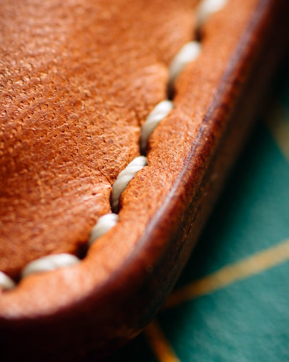 brown leather stitching macro photograph - Some macro stitching shots.bought a new macro lens 90mm 2.8, so I have been trying it out on lots of things. Here is some number 5 MBT thread. #wallet #leatherwallet #cardholder #leathercardholder #cardcase #leathercraft #saddlestitch #verticalwallet #vegtan #vegetabletannedleather #leatherworks #leathergoods #macro #macrophotography