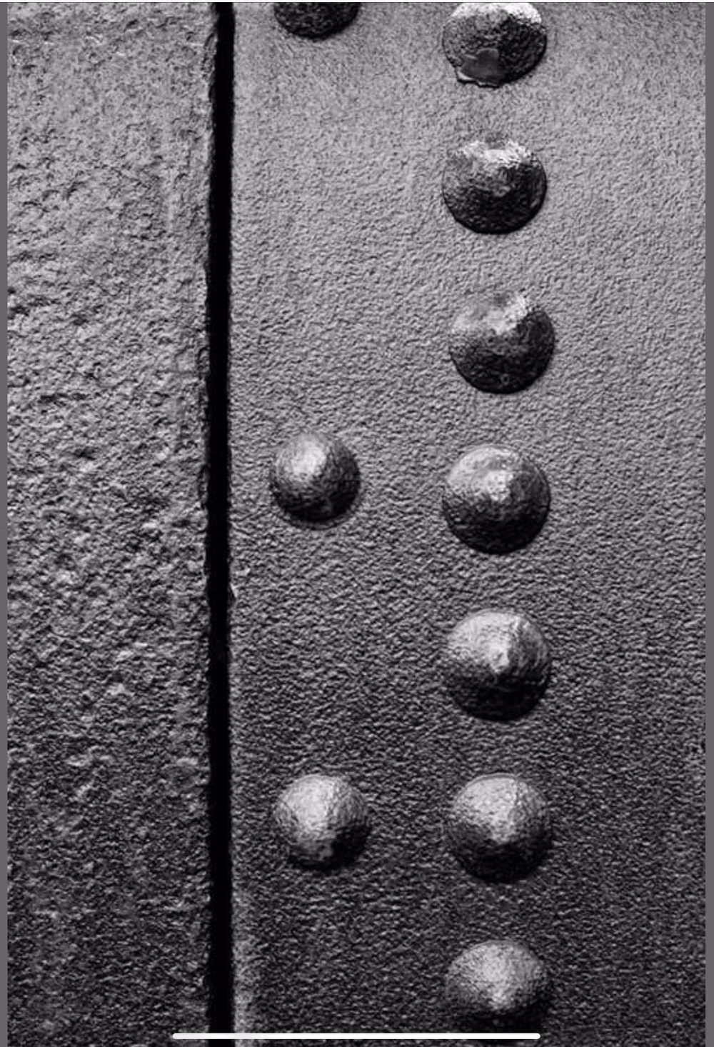 vintage slotted screws metal panel close up -
