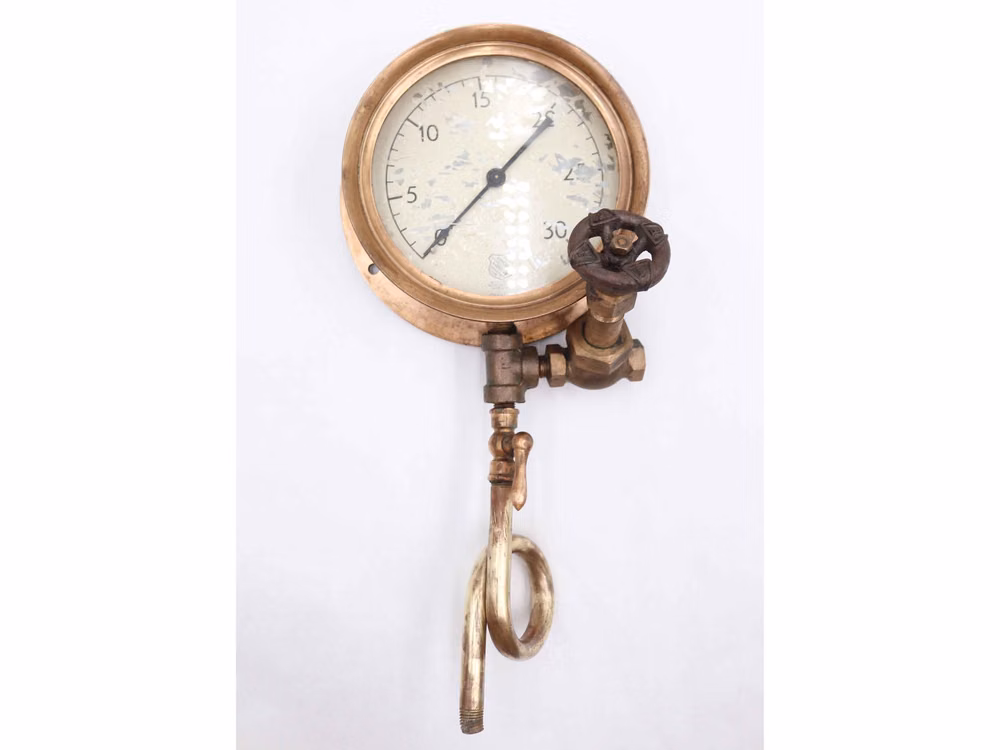 antique steam pressure gauge close up photograph - Antique pressure gauge made of solid brass with a cast iron hand wheel valve. Made by Ashcroft in Bridgeport, Conn. This gauge features a white face with black markings, measuring pressure in increments up to 30. Please refer to the pictures for a full view of the condition. Overall 16.25 in. L x 7.75 in. W x 5.25 in. D, meter 7.75 in. diameter