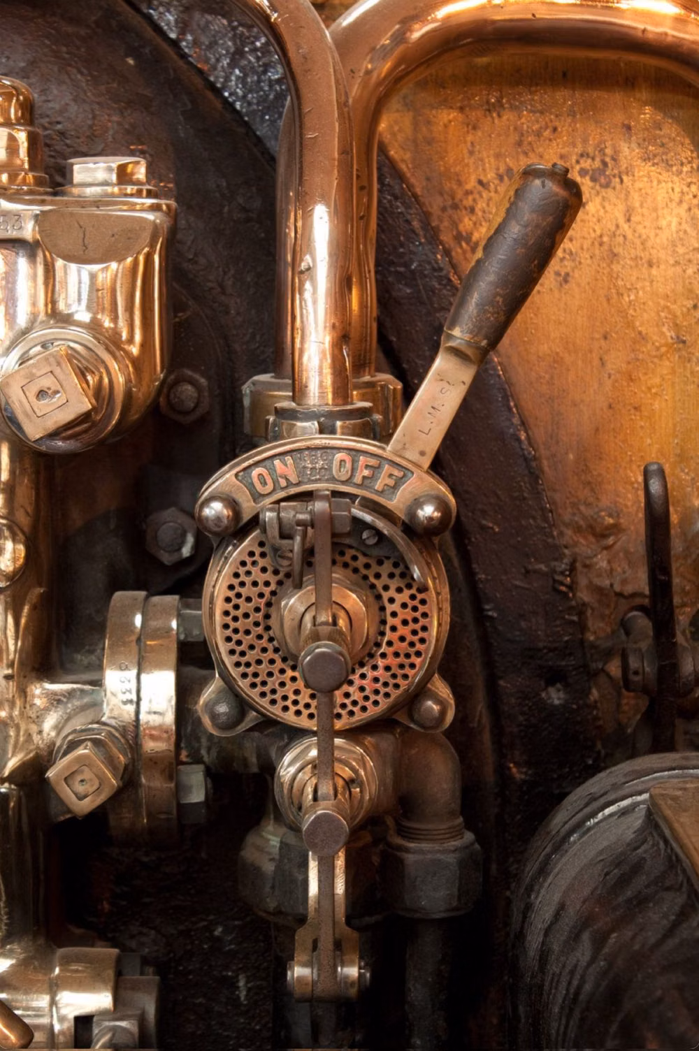 aged copper pipes valves photograph -