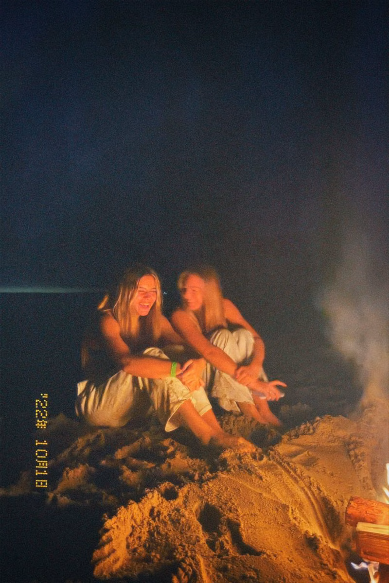 friends beach bonfire candid photograph -