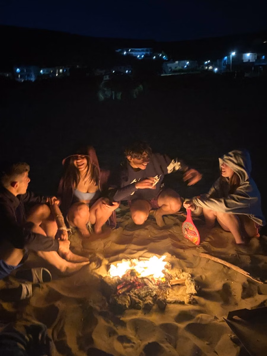 friends beach bonfire candid photograph - beach bonfire
