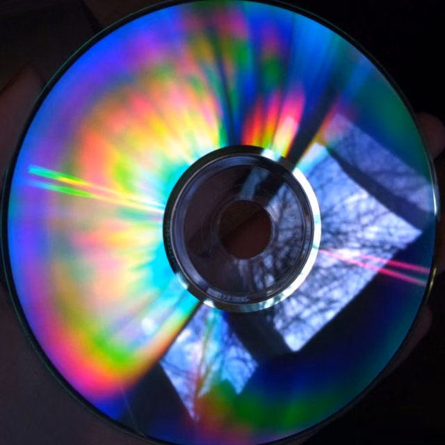 compact disc rainbow reflection macro photograph - CD reflection
